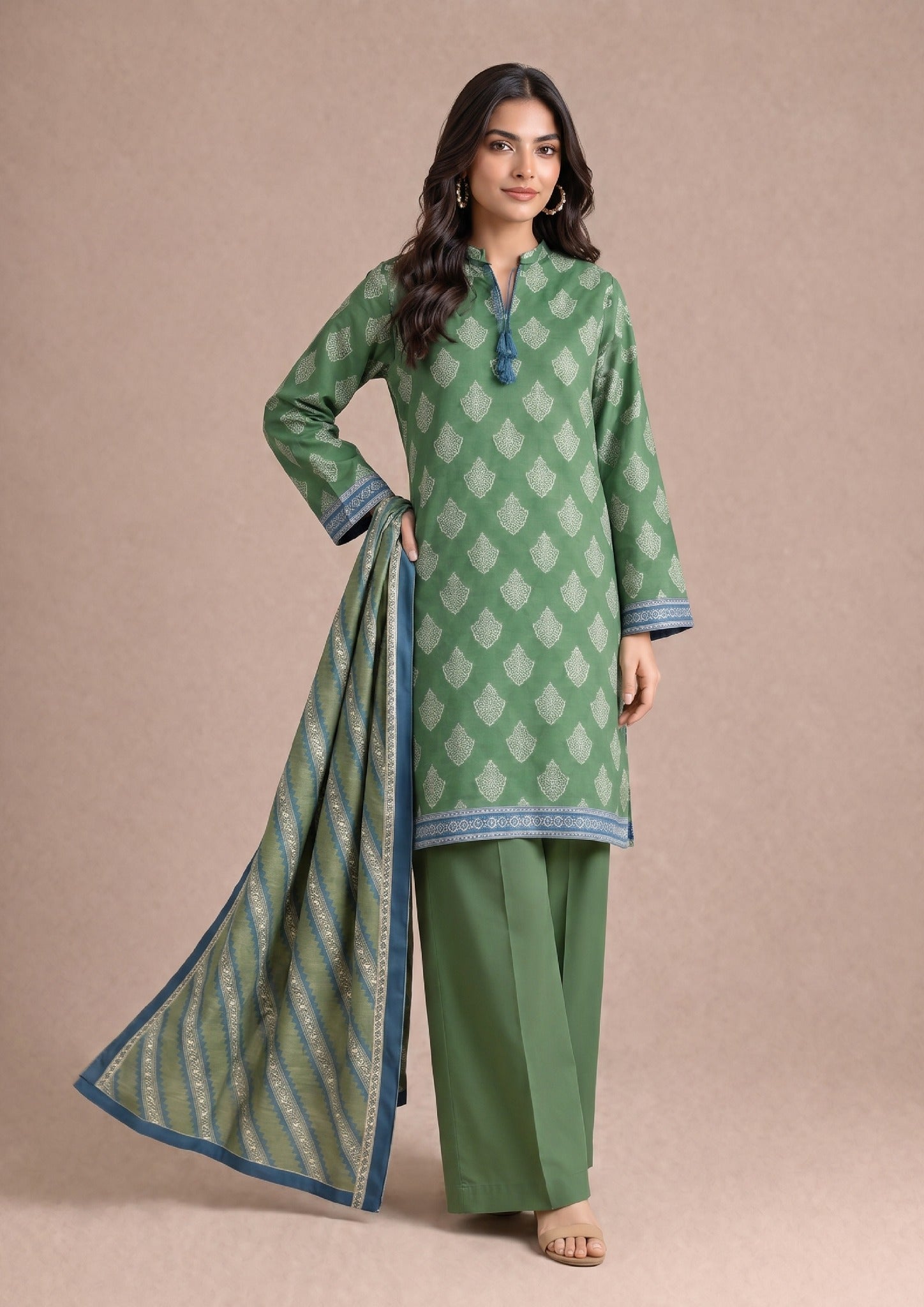Front pose of Greenicious Pakistani printed lawn suit with coordinated printed dupatta and dyed trousers by Mirasl.