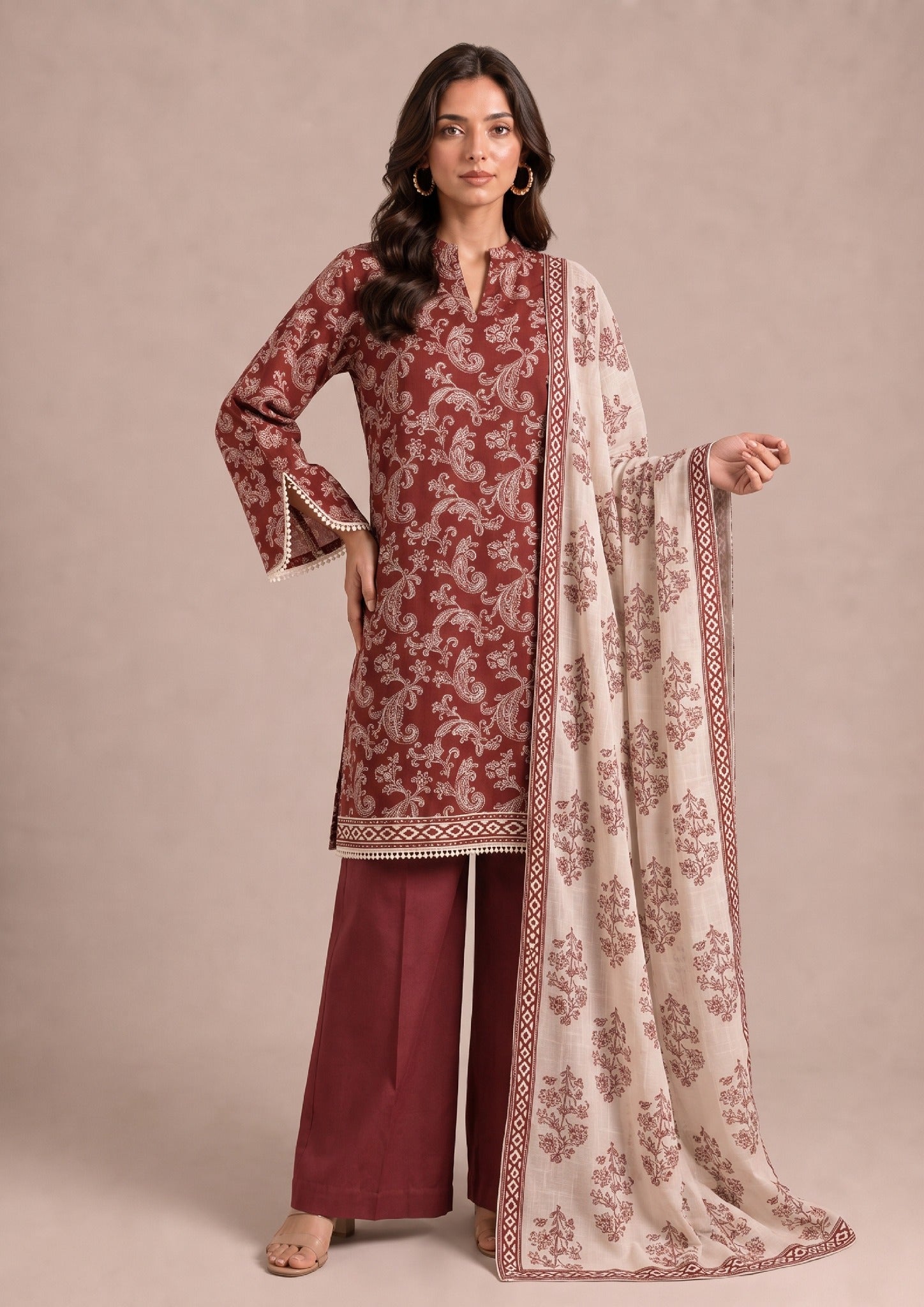 Front pose of Heirloom Pakistani printed cambric lawn suit with matching printed dupatta and wide-leg trousers by Mirasl.