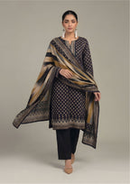 Side view of Ikat Fusion Noir geometric print lawn suit with flowing ochre and blue ikat dupatta and tailored black trouser