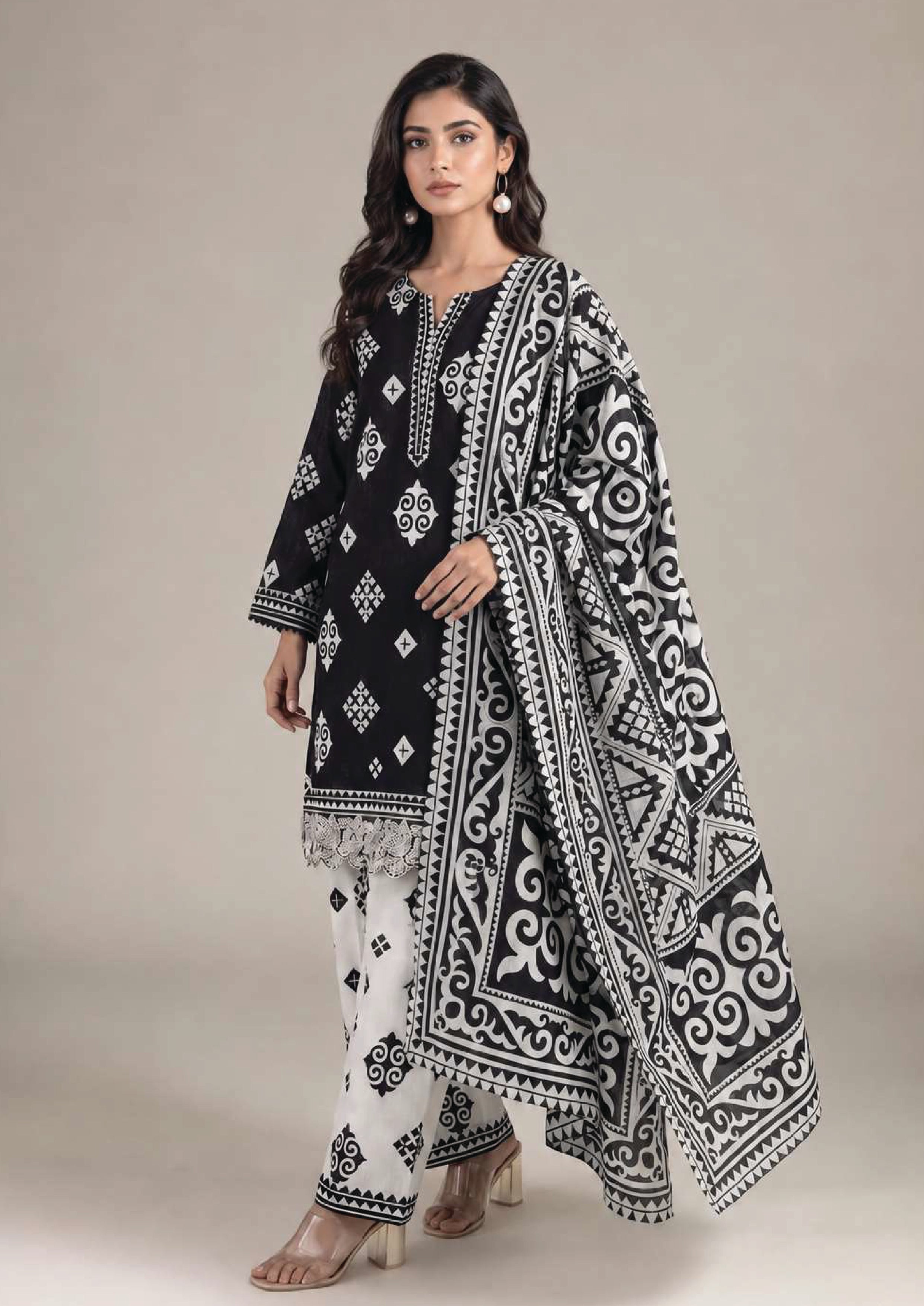 Front view of Inverted Ivory Noir black and ivory 3 piece stitched lawn suit with lace hem, printed trouser and statement dupatta