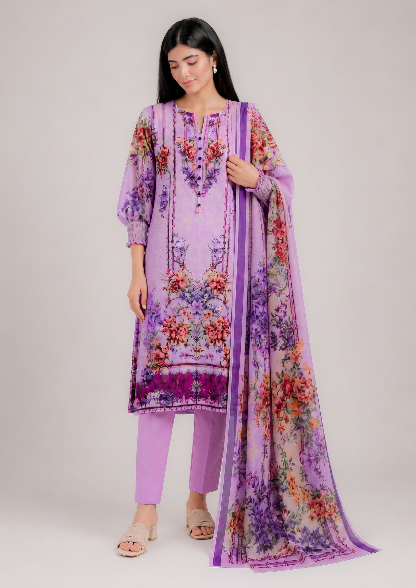 Lilac Ensemble seated product view with floral printed suit and matching dupatta by Mirasl