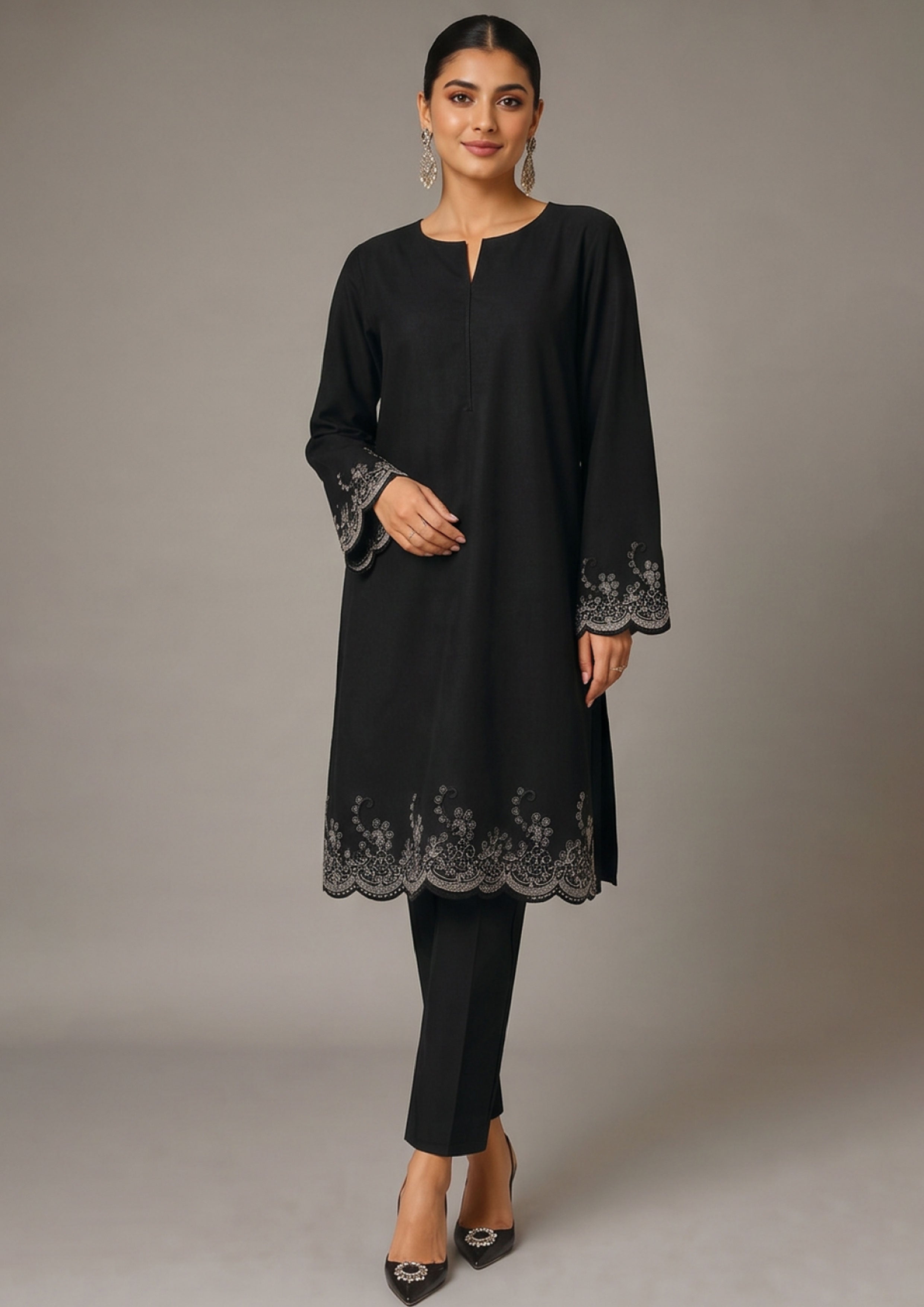 Back view of Minimalist Noir embroidered coard suit showing plain black long shirt, scalloped sleeve border and matching trouser