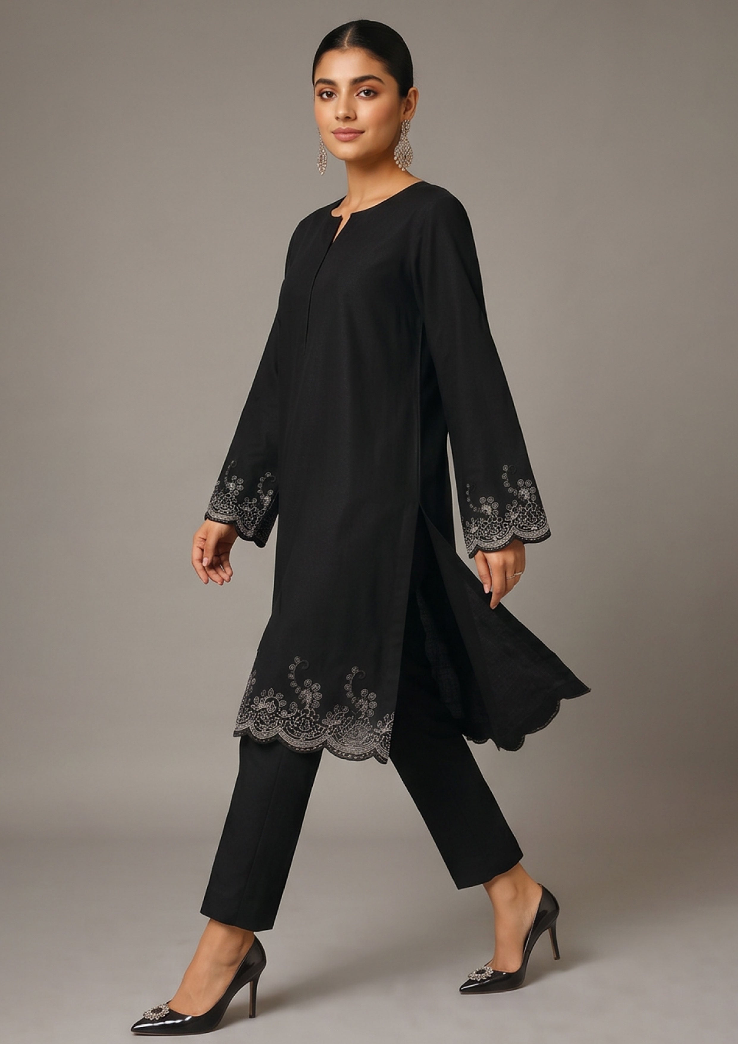 Full front look of Minimalist Noir women co-ord set with black long shirt, floral border embroidery and tailored black trouser