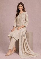 Seated view of Beige Botanica printed lawn suit with matching printed lawn dupatta