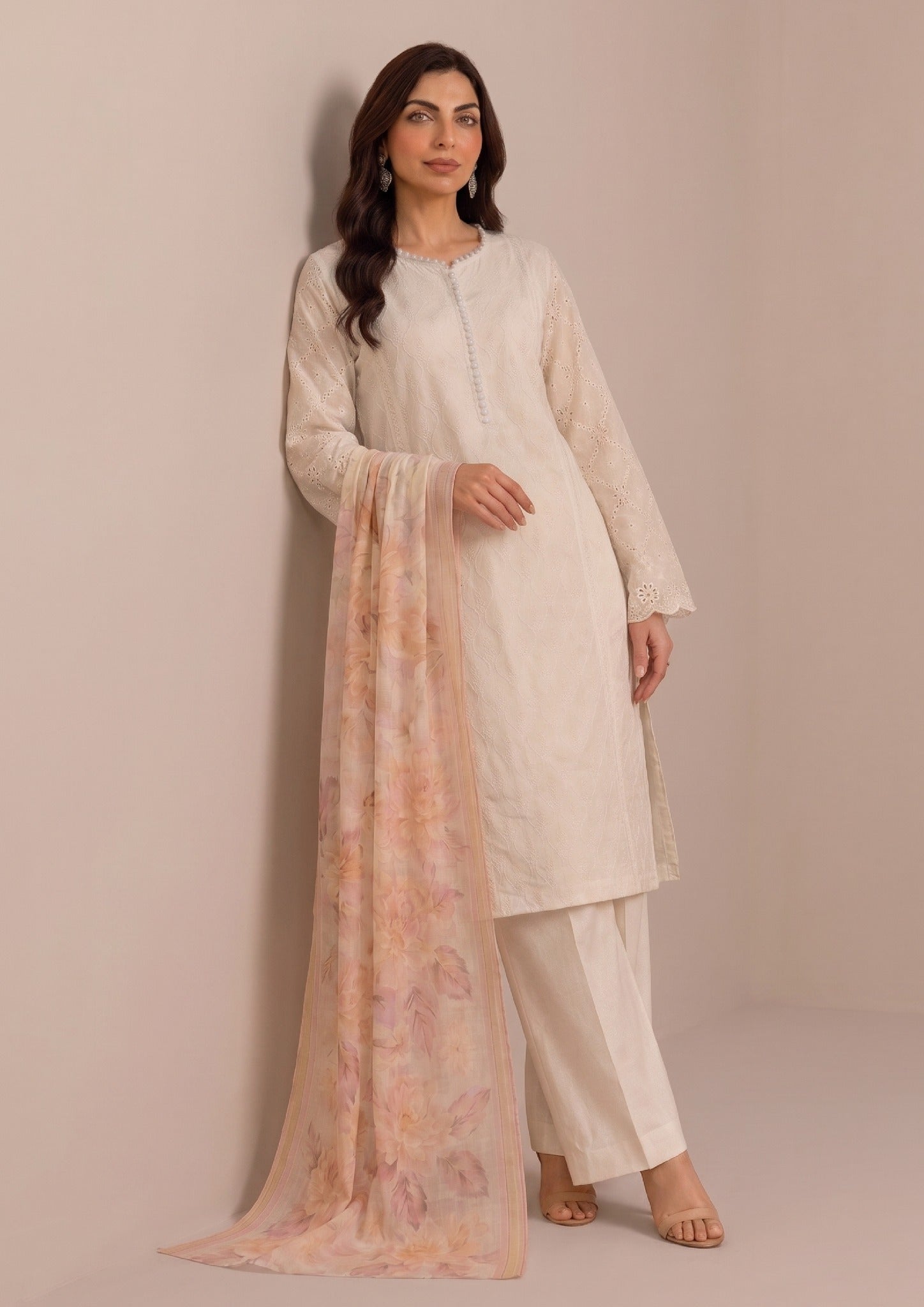 Front full view of Ivory Pearl embroidered lawn suit with matching trousers and printed Georgette dupatta