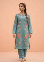 Model wearing Mirasl Spring Marine, a 2 piece stitched co-ord set featuring a marine green floral printed kurti with matching printed trousers
