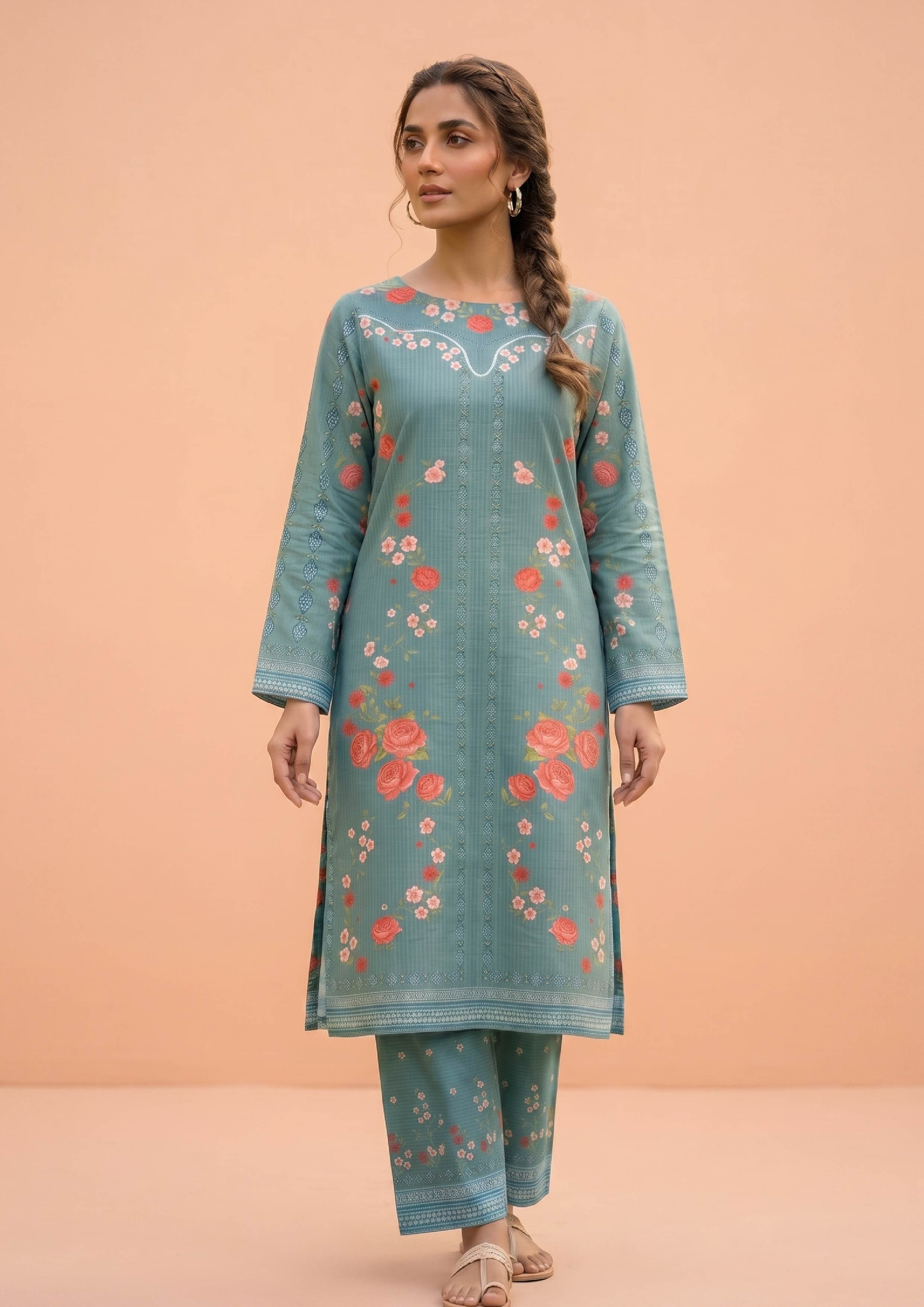 Model wearing Mirasl Spring Marine, a 2 piece stitched co-ord set featuring a marine green floral printed kurti with matching printed trousers