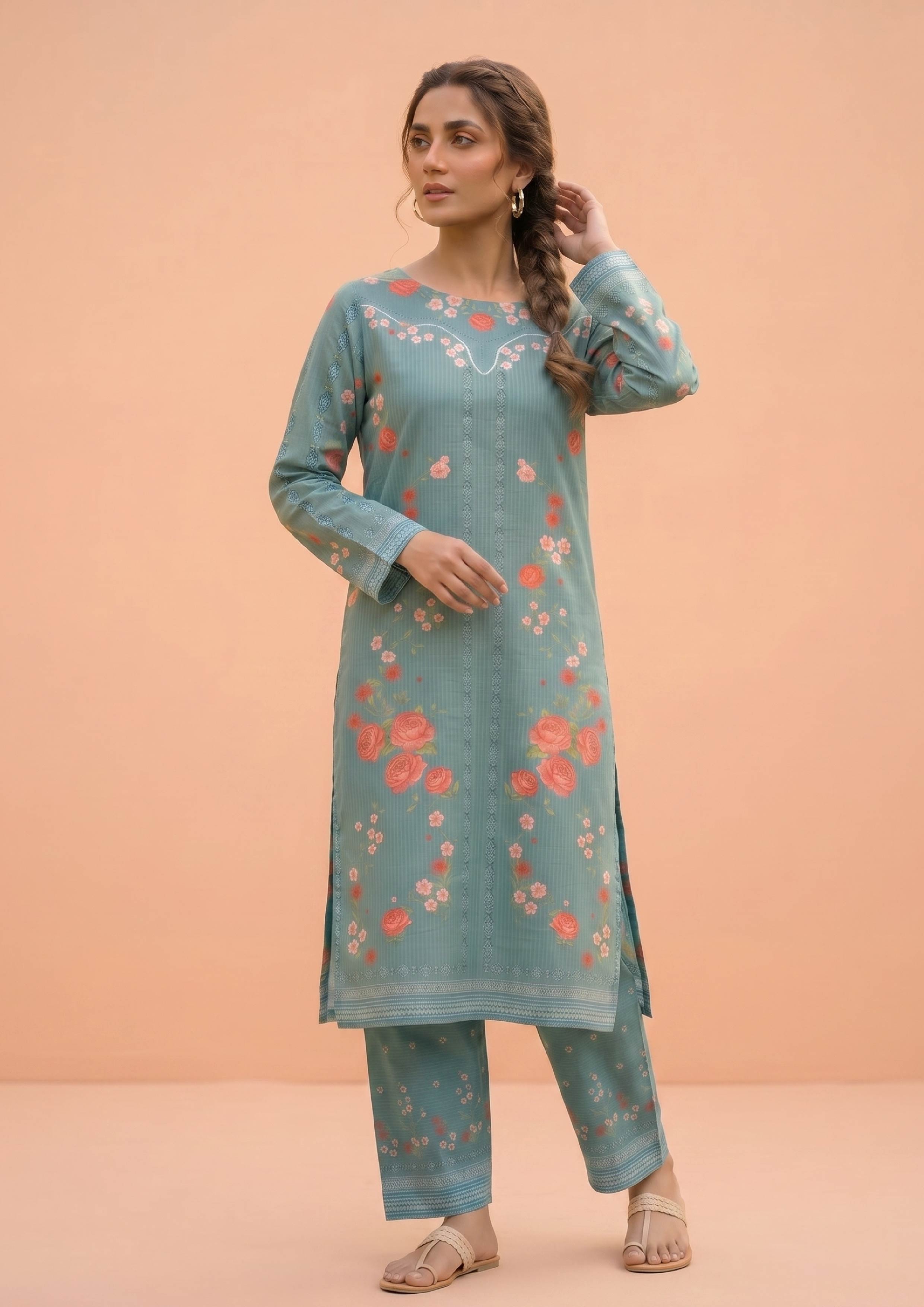 Model seated wearing Mirasl Spring Marine, a ready-to-wear 2 piece stitched co-ord set with marine green floral kurti and matching trousers