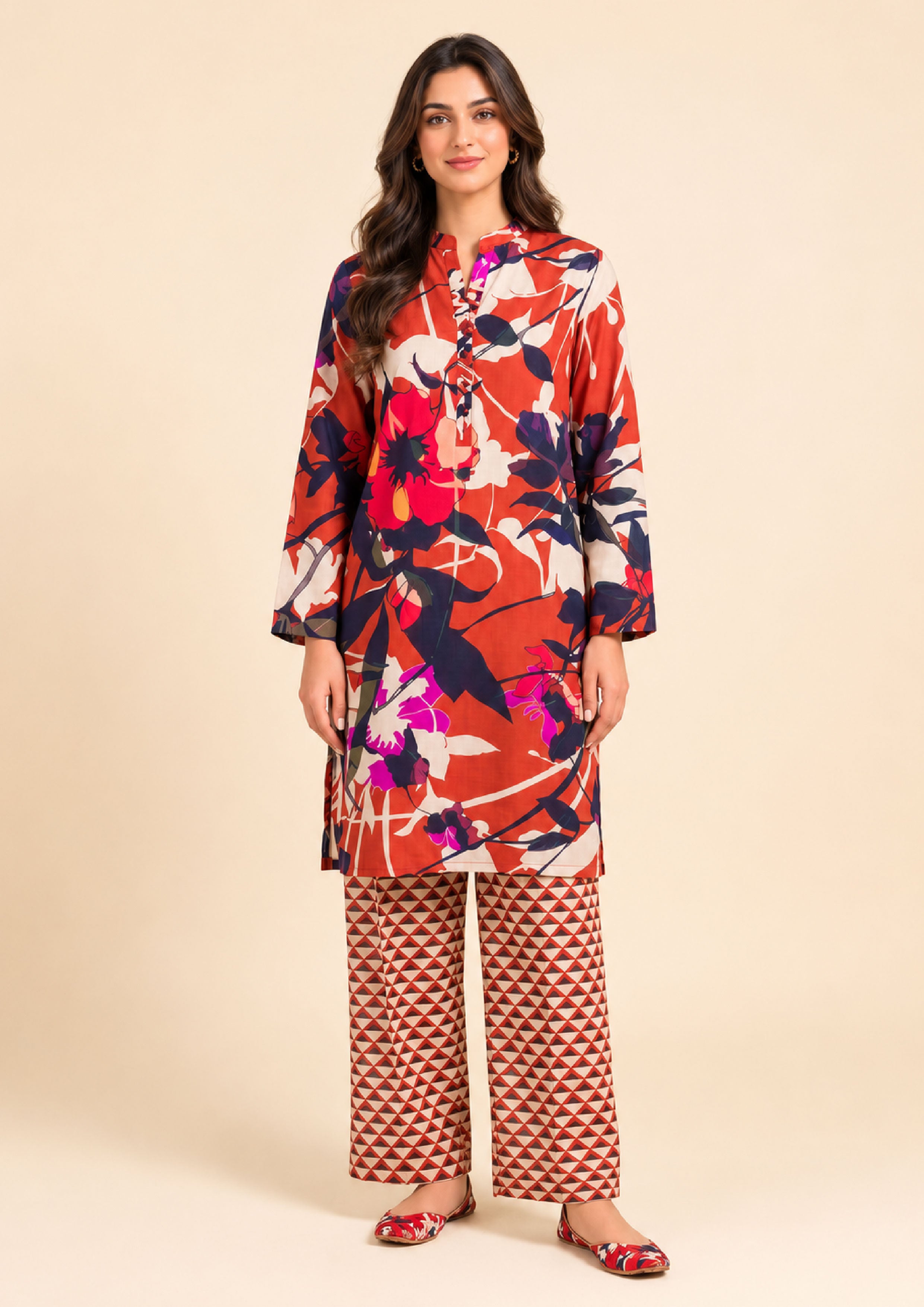 Model wearing Mirasl Terracotta Fusion, 2 piece stitched co-ord set featuring a terracotta floral printed kurti with matching geometric printed trousers
