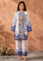 Model wearing Mirasl Ornate Ocean, a 2 piece printed lawn co-ord set in ivory white with ocean blue, navy, and antique gold ornate floral print with matching printed straight trouser.