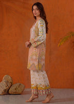 Close side view of Mirasl Peach Blossom printed lawn co-ord set featuring peach floral artwork, V-neck detail and printed sleeve border.