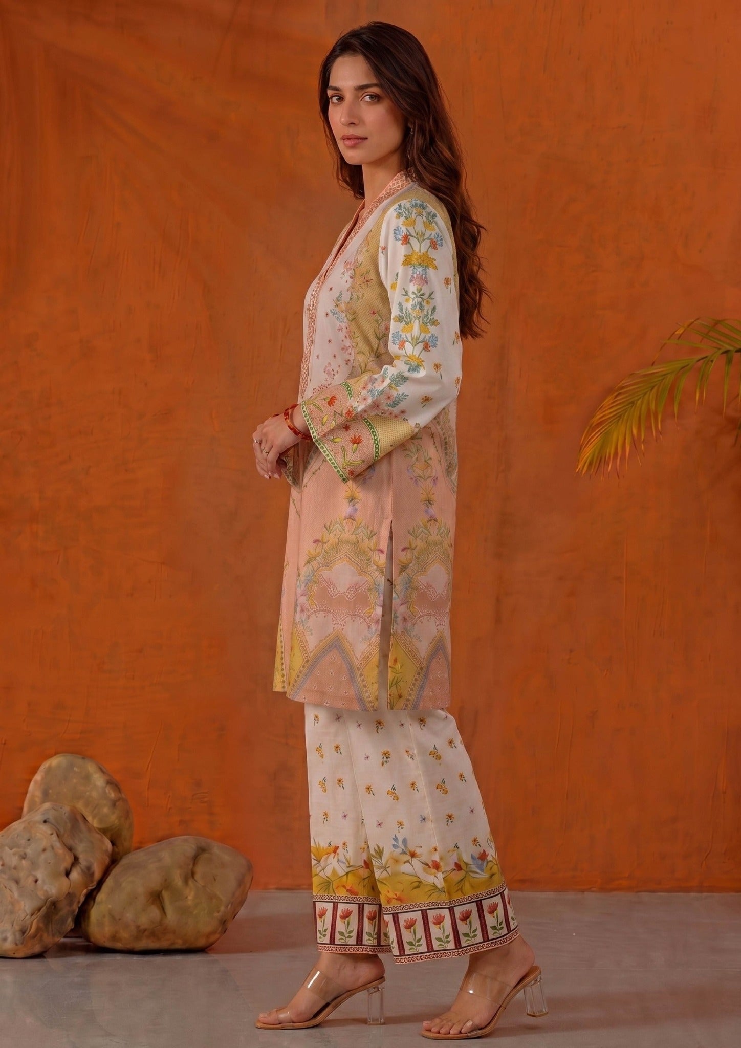 Close side view of Mirasl Peach Blossom printed lawn co-ord set featuring peach floral artwork, V-neck detail and printed sleeve border.