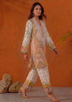 Walking view of Mirasl Peach Blossom ready-to-wear printed lawn co-ord set with soft peach floral shirt and printed straight trouser.