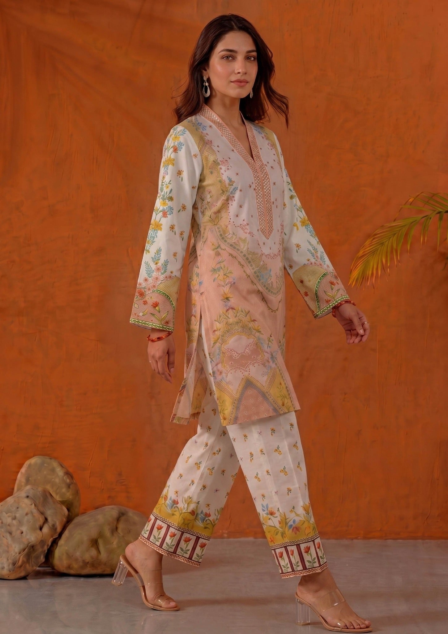 Walking view of Mirasl Peach Blossom ready-to-wear printed lawn co-ord set with soft peach floral shirt and printed straight trouser.