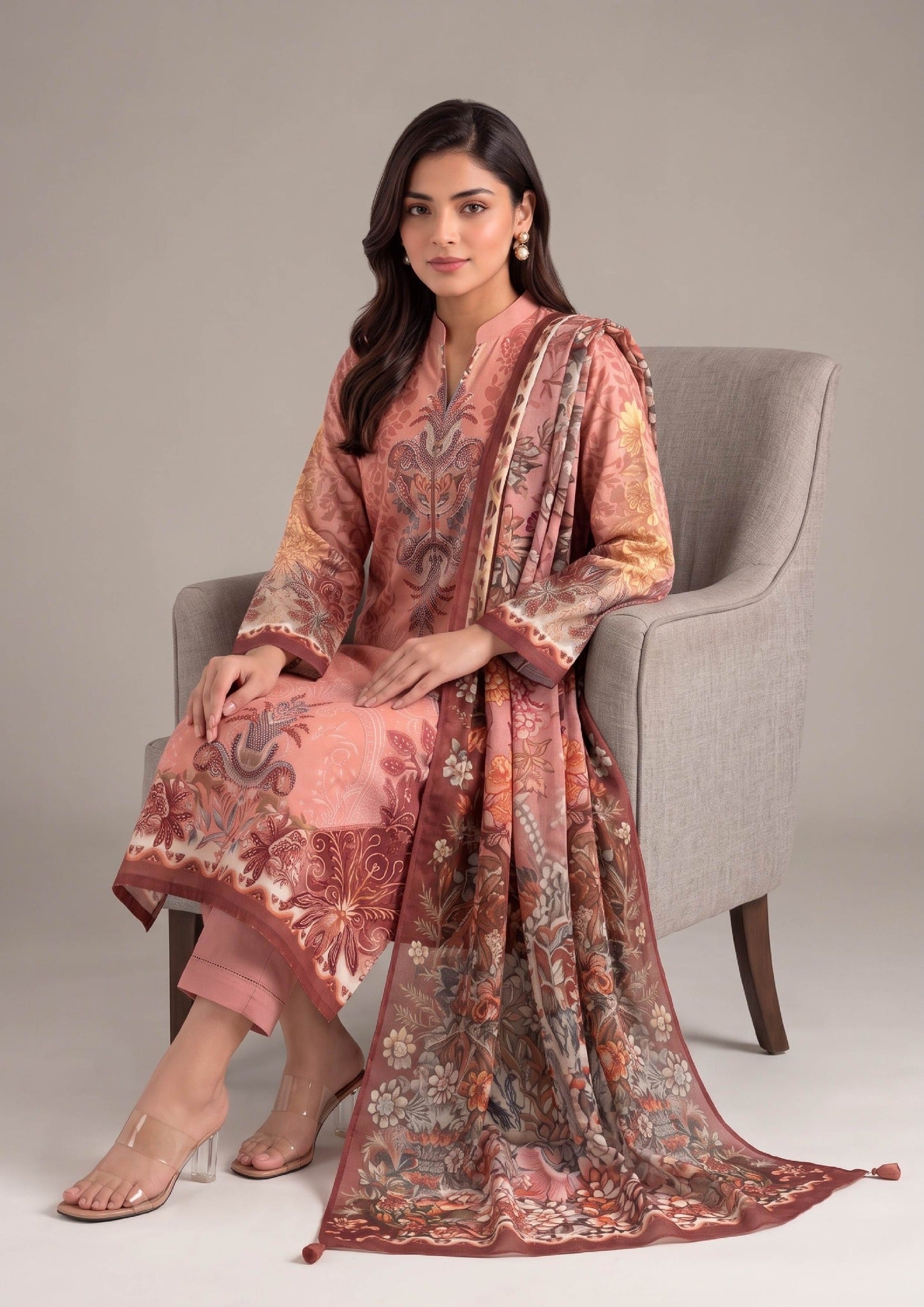 Seated view of Peach Flora 3 Piece Stitched Lawn Suit with coordinated dupatta by Mirasl