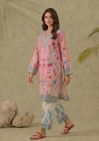 Seated view of Mirasl Petal Pink 2 piece printed lawn co-ord set with floral pink shirt and white printed trouser.