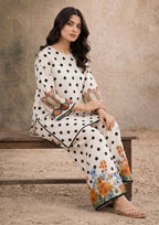 Petal Polka black and ivory 2 piece printed lawn co-ord set by Mirasl with floral border detailing, seated view
