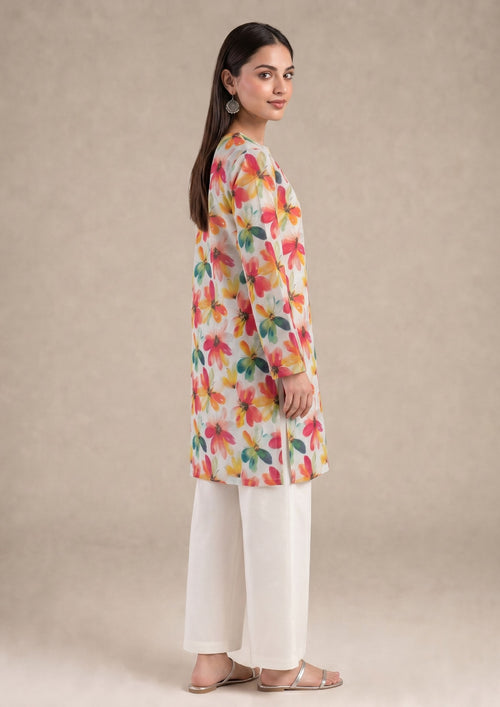 Front view of Petal Radiance 2 piece printed lawn co-ord set by Mirasl featuring a knee-level floral shirt, slit neckline, full sleeves, and white trouser.