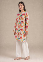 Side view of Petal Radiance printed lawn co-ord set showing the relaxed straight fit, colorful floral print, side slits, and white straight trouser.
