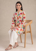 Standing view of Petal Radiance by Mirasl featuring an ivory printed lawn shirt with coral, orange, yellow, teal, and green floral details.