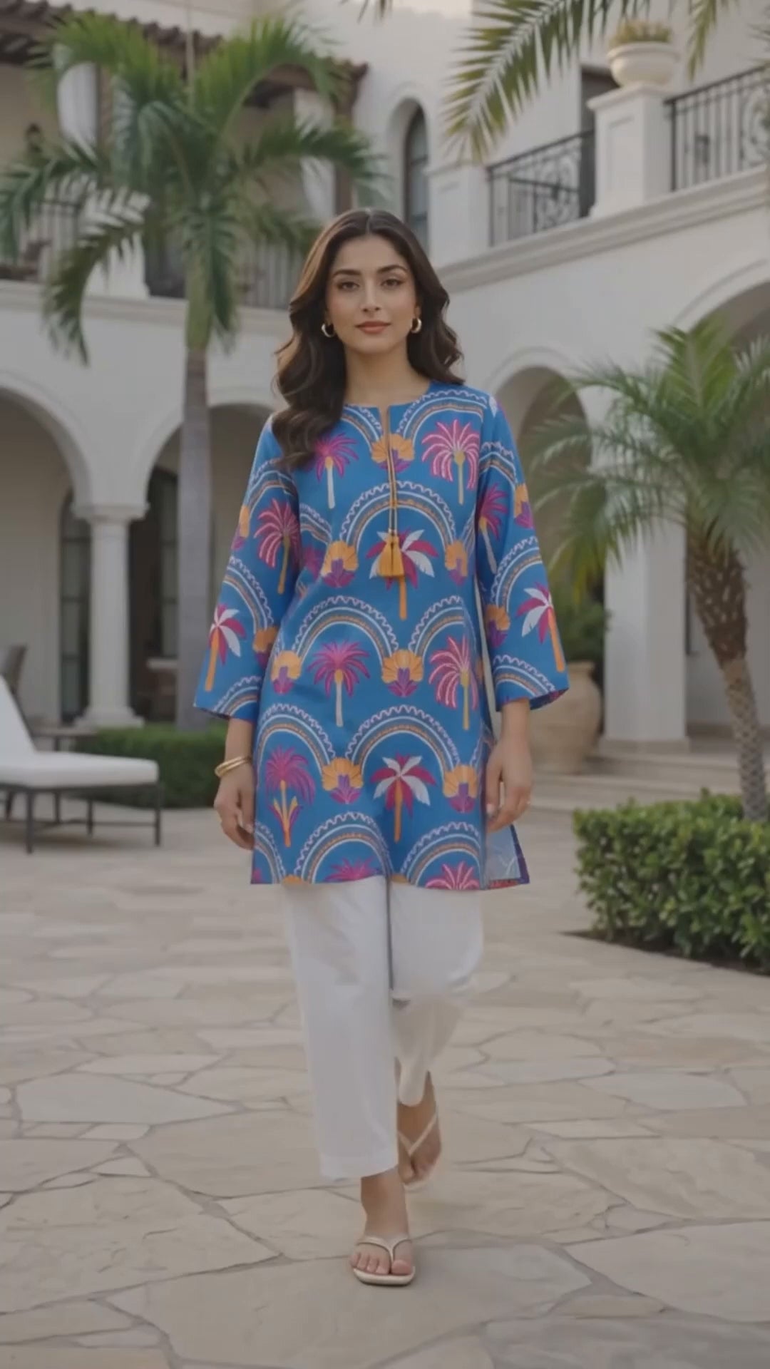 Azure Oasis blue printed lawn 2 piece co-ord set by Mirasl, featuring a palm print shirt styled in a premium outdoor fashion video.