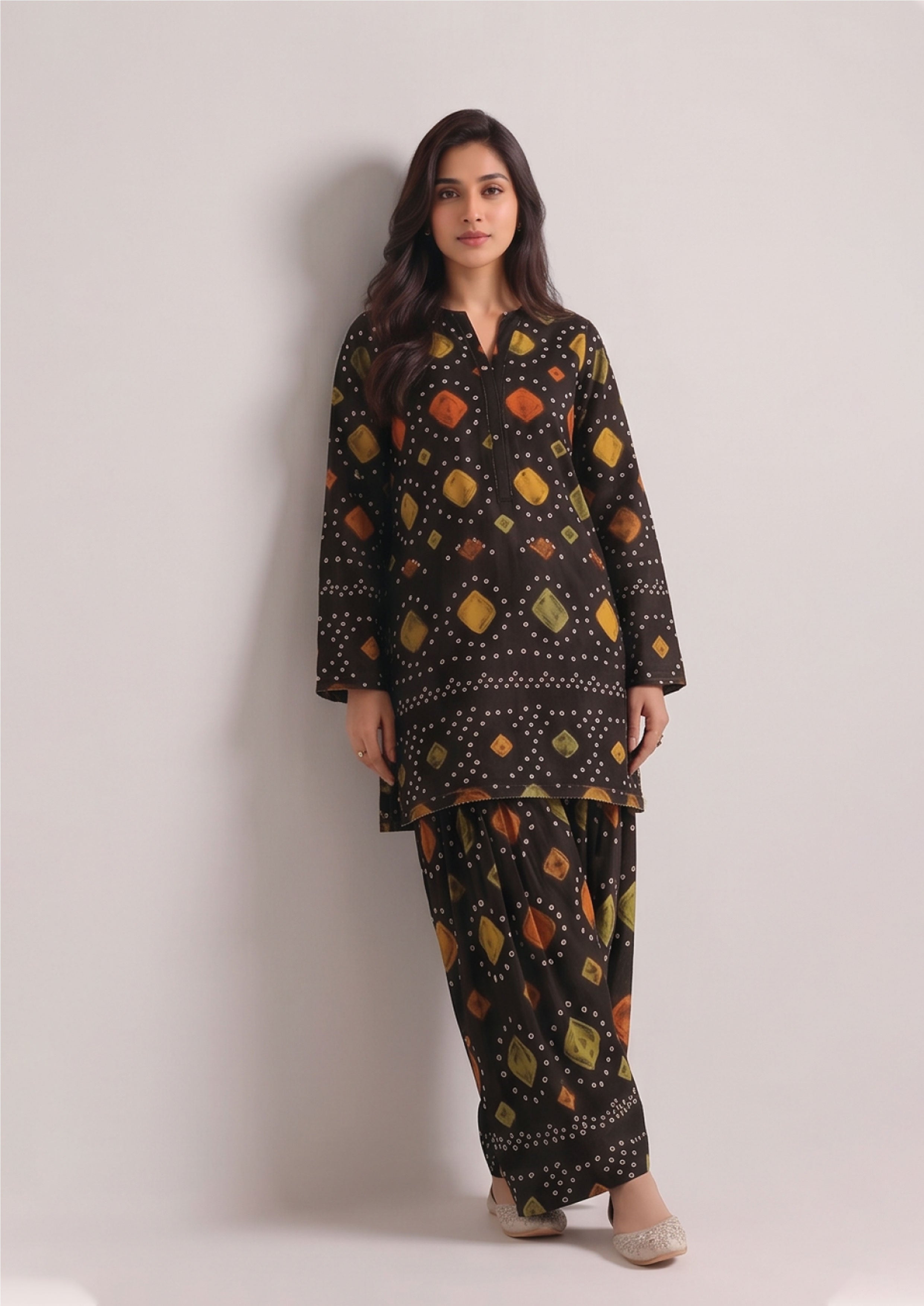 Back side view of Radiant Chunri Noir black printed Patiala shalwar suit with flowing matching dupatta
