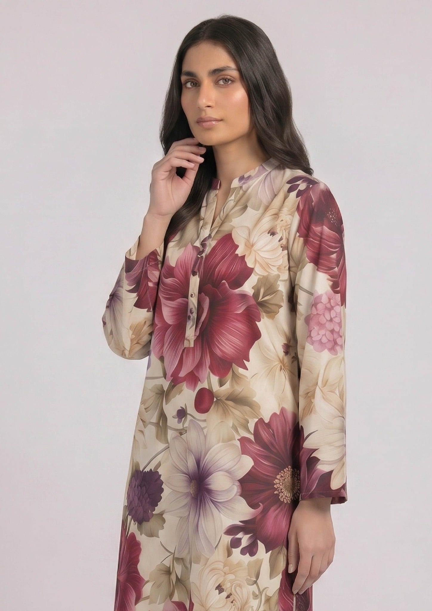 Ruby Petal printed lawn co ord set seated view with floral shirt and trouser.