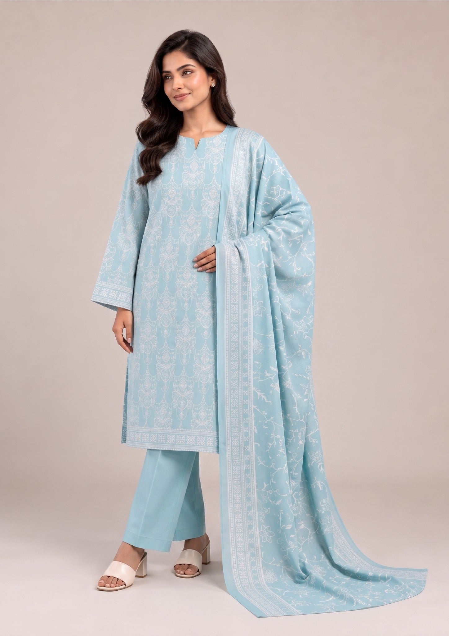Elegant front styling pose of Serene Sky printed lawn suit showcasing the coordinated printed lawn dupatta, ornamental shirt print and dyed trousers by Mirasl.