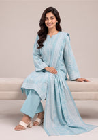 Seated editorial pose of Serene Sky printed lawn suit emphasizing premium lawn fabric, decorative borders and coordinated dupatta styling by Mirasl.