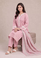 Seated editorial pose of Soft Rose 3 Piece Stitched Printed Lawn Suit showcasing the soft pink printed lawn fabric, dupatta drape and summer styling by Mirasl.