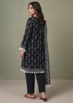 Tassel Bloom Noir ready to wear suit by Mirasl showing tassel neckline detail and black printed lawn shirt