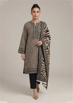 Seated model wearing Urban Safari Noir Pakistani lawn suit with leopard print shirt, tiger stripe dupatta and black trouser