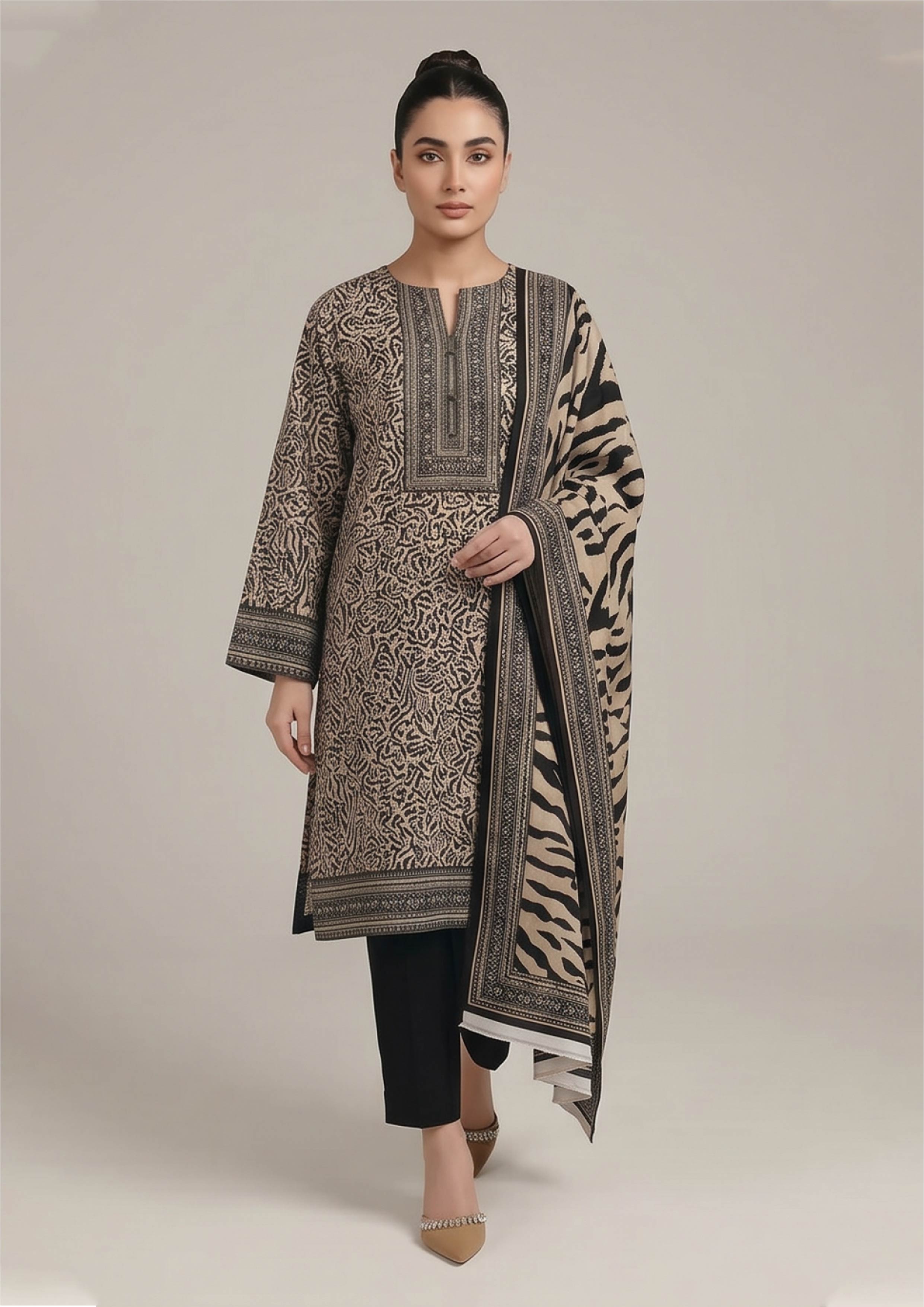 Seated model wearing Urban Safari Noir Pakistani lawn suit with leopard print shirt, tiger stripe dupatta and black trouser